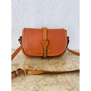Vtg DOONEY and BOURKE AWL burn orange saddle round small shoulder bag crossbody